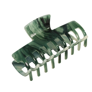 Dark green marble patterned acetate hair claw clip for women on a white background