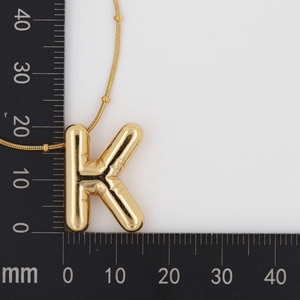 Detail showing dimensions of the gold balloon-style letter K pendant with bead chain