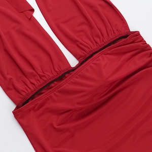 Detail of red slim fit dress showing elegant pleated waist and cut-out elastic fabric