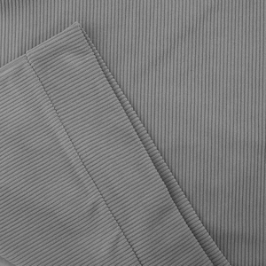 Macro shot of grey ribbed corduroy fabric showing fine vertical texture and premium weave