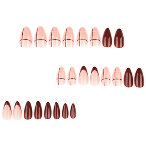 Short almond press-on nails set featuring red French tips and minimalist line art designs
