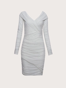 Detail of white deep V-neck evening dress with shimmering glitter and ruched mesh fabric