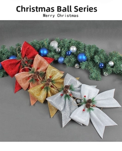 Detailed view of Christmas glitter bows with natural pine cones and festive berries
