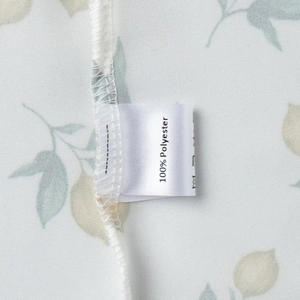 Detail of 100% polyester fabric floral print and high-quality stitching on sundress