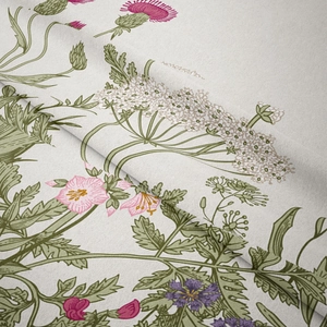 Close-up of high-quality canvas fabric with detailed pink and purple floral prints