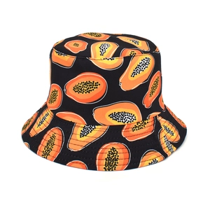 Close-up of vibrant papaya print pattern on black bucket hat fabric texture