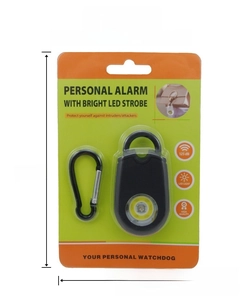 Detail of personal safety alarm with 125dB siren and LED strobe in blister packaging