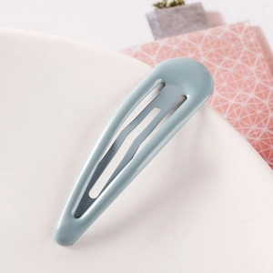 Close-up of Morandi blue teardrop metal hair clip with a smooth painted finish for girls
