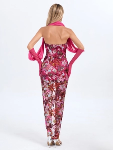 Detail of fuchsia sequin floral embroidery on a mesh dress with matching mesh gloves