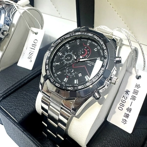 Detail view of the silver stainless steel business watch with black tachymeter dial