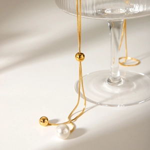 Gold snake chain necklace with pearl pendant and adjustable metal ball bead slider