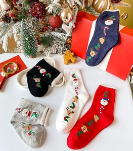 Detailed set of thick cotton Christmas socks in five festive colors with warm fleece lining
