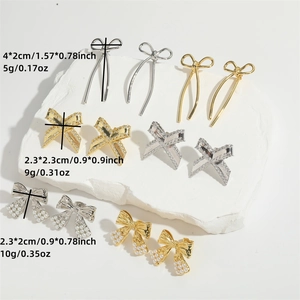 Elegant gold and silver bow earrings with pearls and zircons, detailed dimensions shown