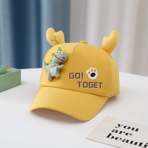 Detailed view of yellow cotton kids baseball cap with cute dinosaur patch and animal ears
