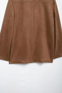 Detailed back view of a brown velvet blazer jacket with textured seams and stitching