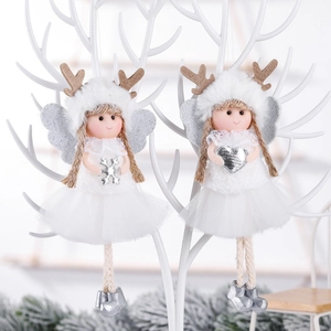 Christmas plush angel ornaments with silver wings and tulle skirts on a white branch