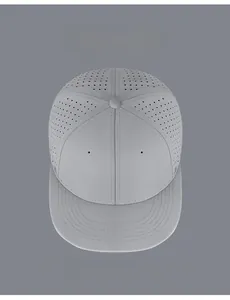 Top view of dark grey hip-hop cap showing laser-cut ventilation holes and sleek fabric