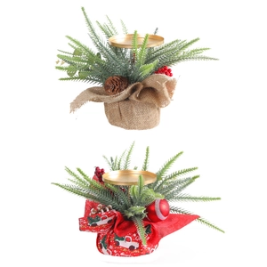 Christmas candle holder with pine needles, red berries and pinecones on a gold tray