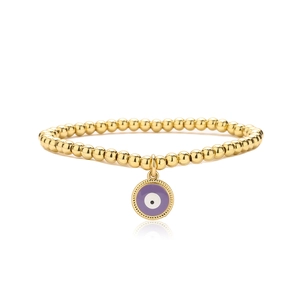 Macro shot of gold beaded bracelet featuring a purple evil eye charm with reflection