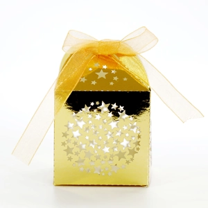 Close-up of golden star-shaped hollow gift box with a matching ribbon bow