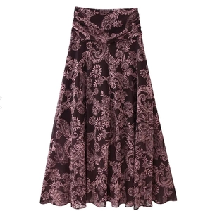 Detail of high-waist paisley print maxi skirt with intricate floral patterns on dark fabric