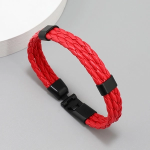 Close-up of red braided leather bracelet with high-quality black metal magnetic clasp