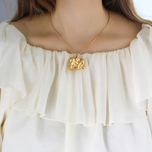 Elegant gold-plated elephant pendant necklace for women shown on a model neck