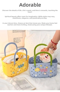 Close-up of portable plastic bath basket with breathable holes and cartoon eye decor