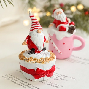 Christmas resin ornaments featuring Santa and elf on cake and mug for holiday decor