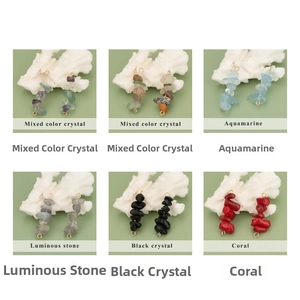 Macro shot of assorted natural crystal stone pendants with golden metal hanging loops