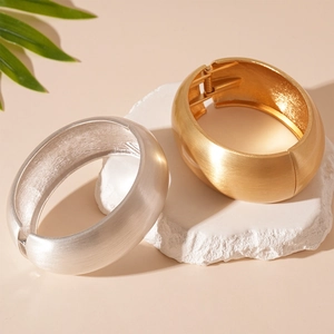 Exaggerated geometric matte brushed metal adjustable cuffs in gold and silver finish