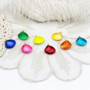 Colorful shell charm set with gold loops for DIY jewelry, ocean themed craft pendants