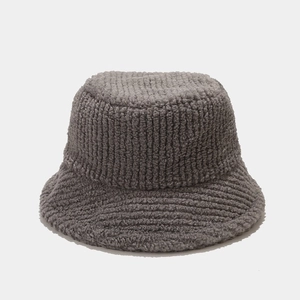 Close-up of thick dark grey plush fisherman hat showing premium knit texture and warmth