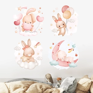 Detail of watercolor rabbit wall stickers with balloons and stars in a nursery