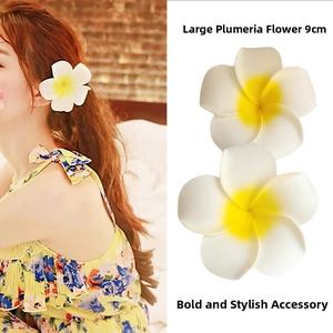 Macro detail of 9cm Plumeria hair clip with white petals and yellow center on a model