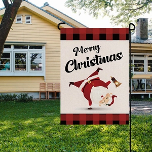 Garden flag featuring Santa Claus and Merry Christmas text with red plaid borders