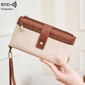 Detailed RFID protection view of a beige and brown faux leather women's zip clutch wallet