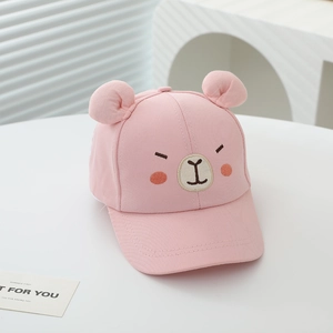 Close-up of pink children baseball cap featuring cute 3D bear ears and soft cotton texture