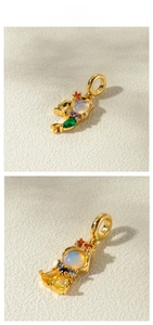 Detail of fishtail princess gold pendant featuring colorful cubic zirconia and opal inlay