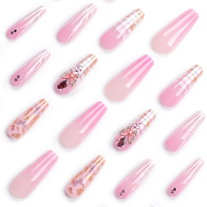 Extra long pink coffin press-on nails with butterfly charms, marble patterns and gold foil
