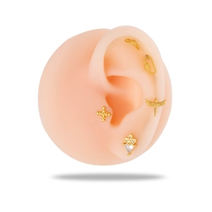 Golden stainless steel cartilage stud earring set with wings, cross, and crown charms