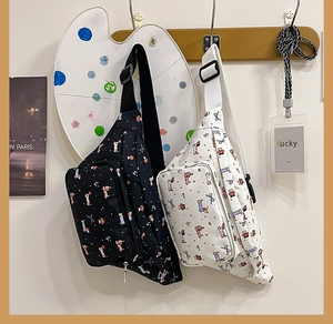Detailed view of cute dog pattern and polka dots on a casual canvas crossbody bag