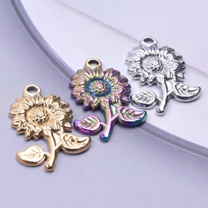Detailed trio of sunflower pendants in gold, rainbow, and silver stainless steel finish