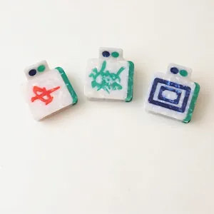 Three creative Mahjong style hair claws with acetate marble texture in red and green