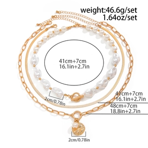 Detailed flat lay of tiered baroque pearl necklaces with golden coin pendant and sizing