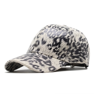 Detail of classic leopard print baseball cap with cream base and curved brim design