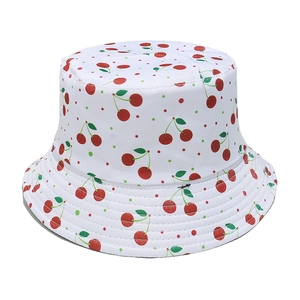 White sun hat for women with red cherry print and wide brim for summer UV protection