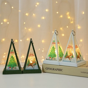 Close-up of LED Christmas lanterns with reindeer prints on a festive white table