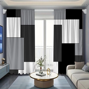 Detail of modern black and grey geometric patchwork curtains in a minimalist living room
