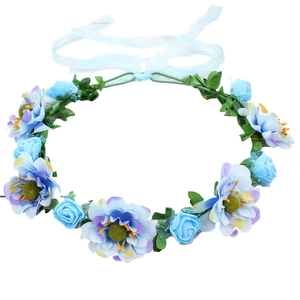 Bohemian floral crown with blue and purple artificial roses and a ribbon tie accessory